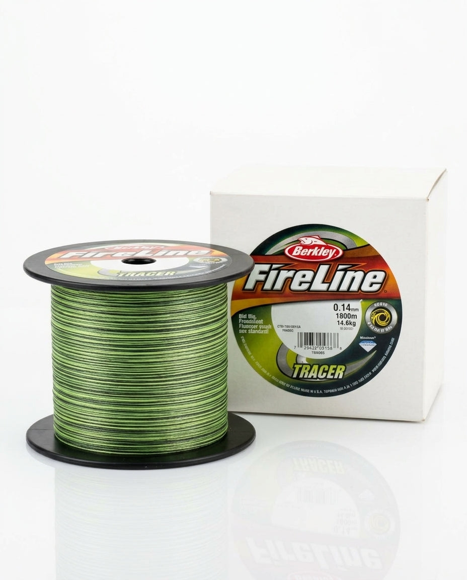 A spool of green Berkley FireLine Tracer fishing line stands in front of its white retail box on a clean white background.