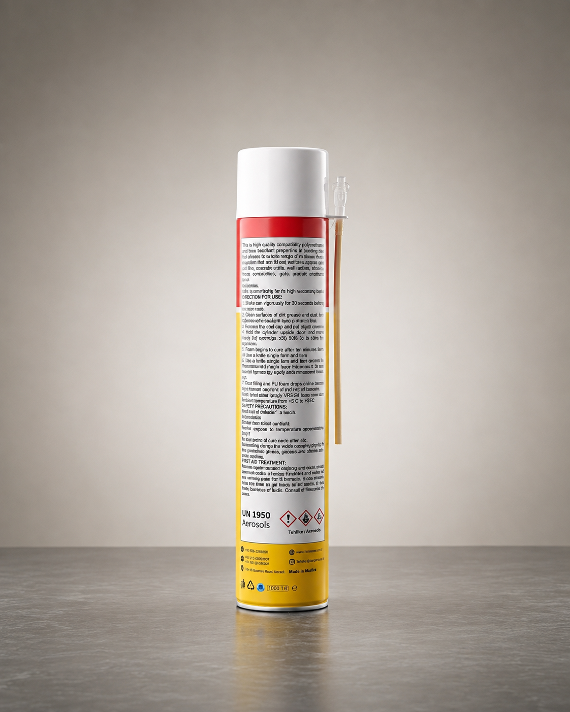 A can of WD-40 Specialist anti-freeze and degreaser spray, shown from the back with its white cap, white label, yellow base, and a clear applicator wand resting against it, set on a gray surface against a neutral gray background.